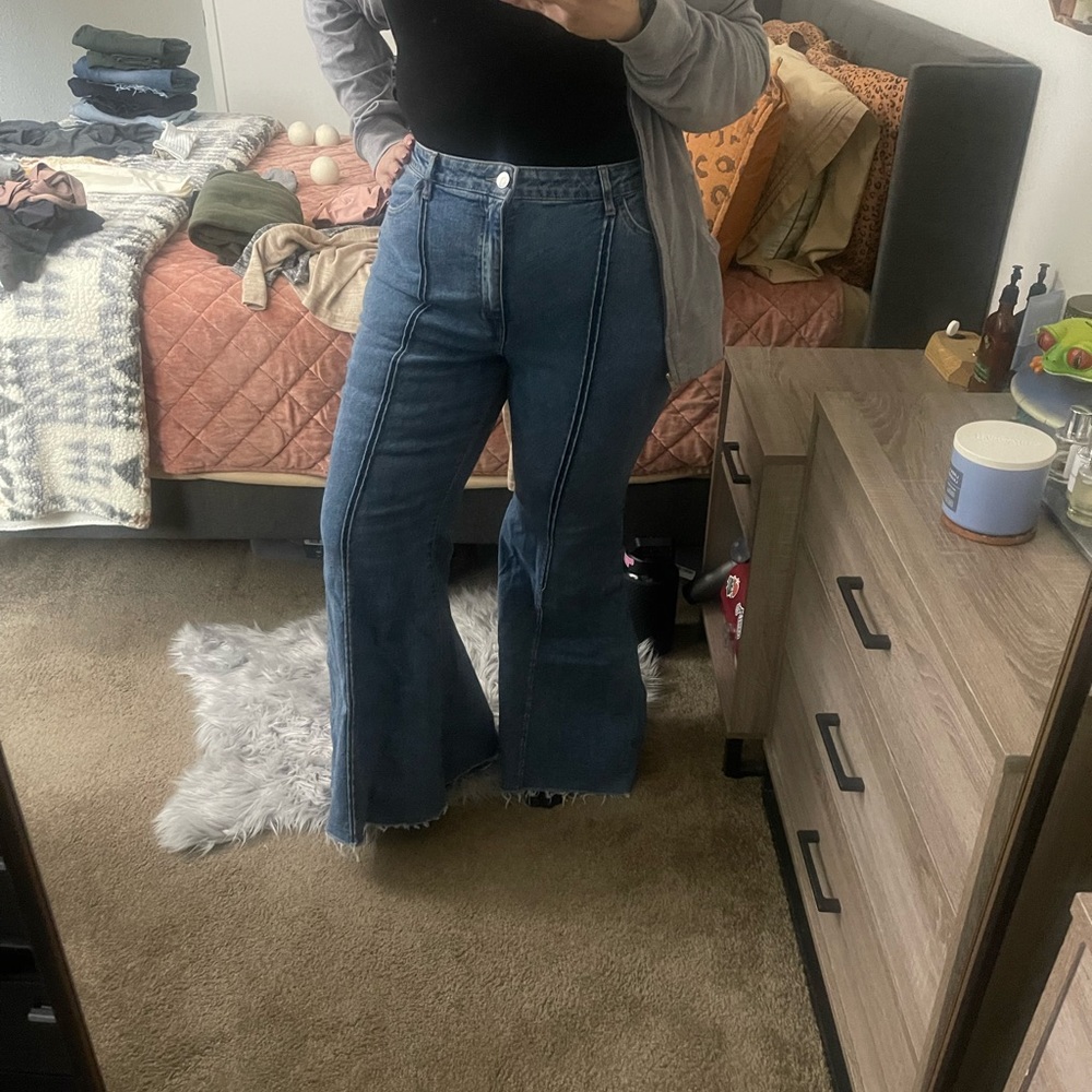 Bell bottom distressed hem jeans